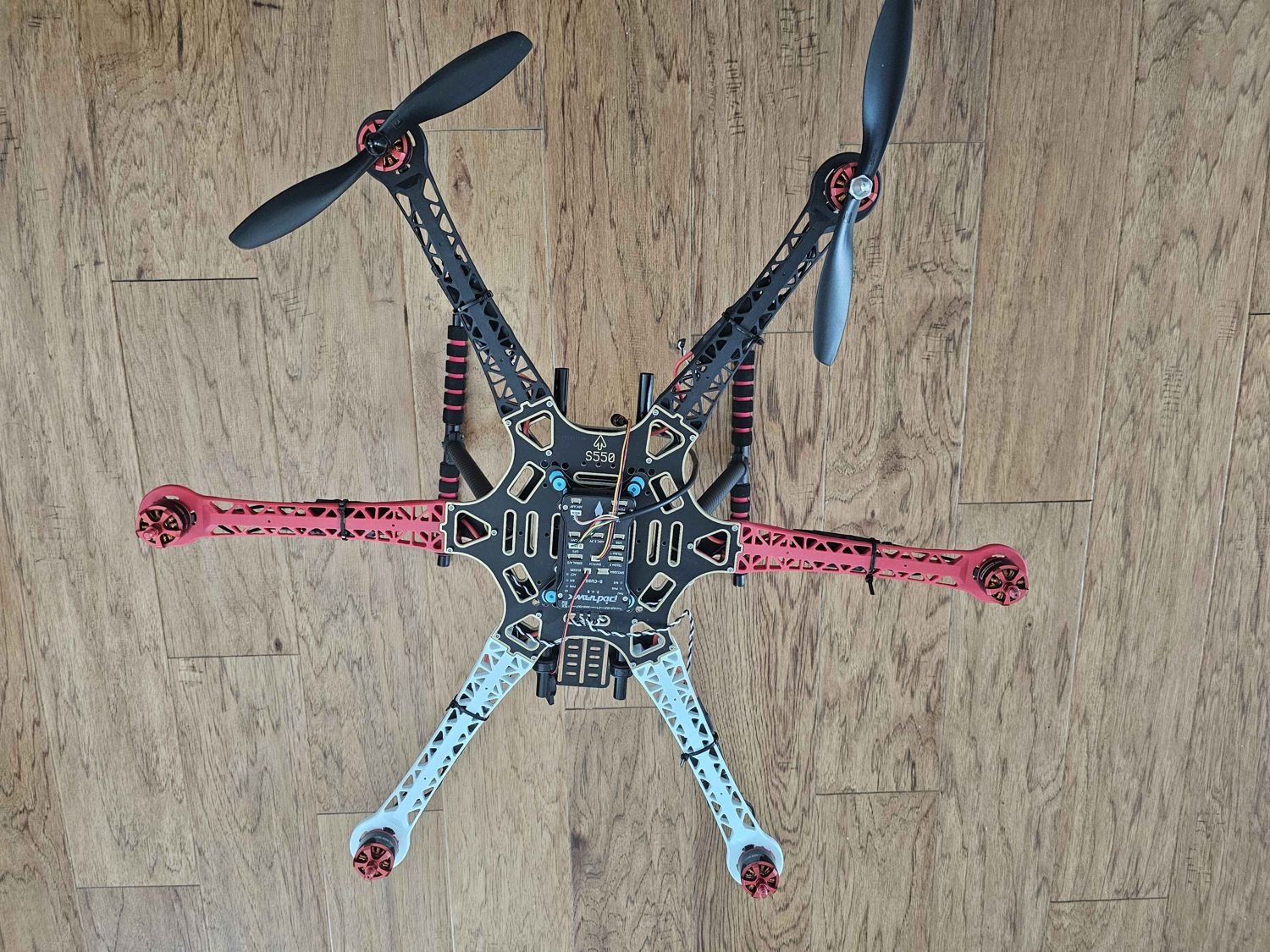 FPV drone, full frame with propellers, top-down view